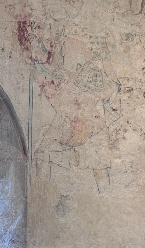 14th century wallpainting of St Christopher carrying the Christ Child

